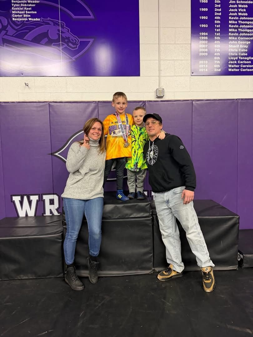 NOVA athlete on the podium with family